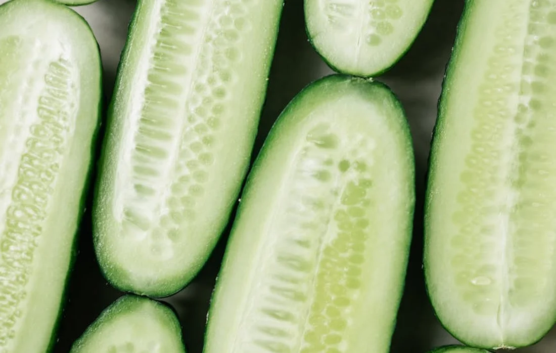 Close-up of fresh cucumber slices showing pale green flesh and seeds