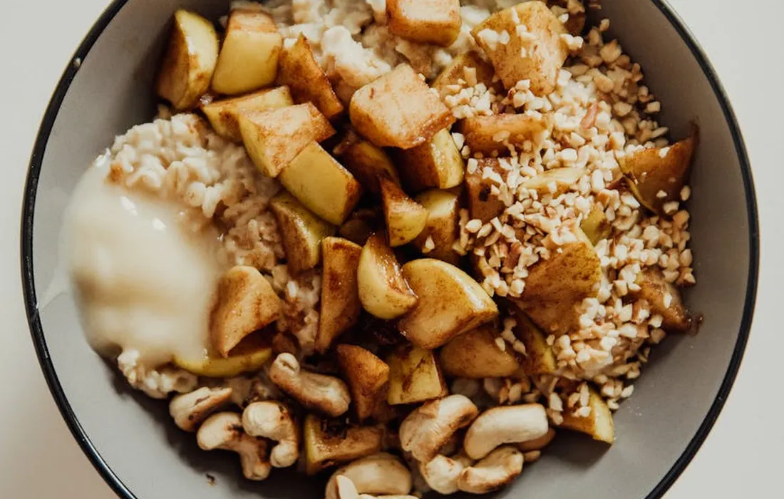 Bowl of chopped apples, oats, and nuts as a sample safe-fruit feeding mix for sheep